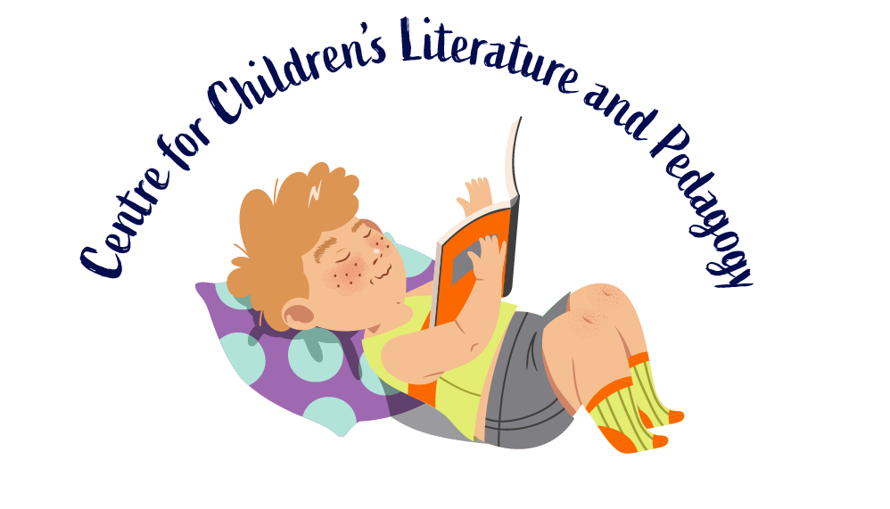 Boy lying down and reading a book